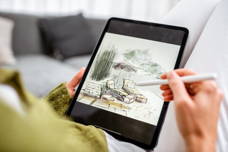 Woman drawing landscape design on a digital tablet